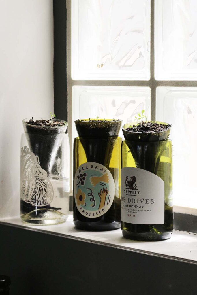 5 Upcycled Handmade Gift Ideas For Eco-Friendly Babes: diy wine bottle self watering planters